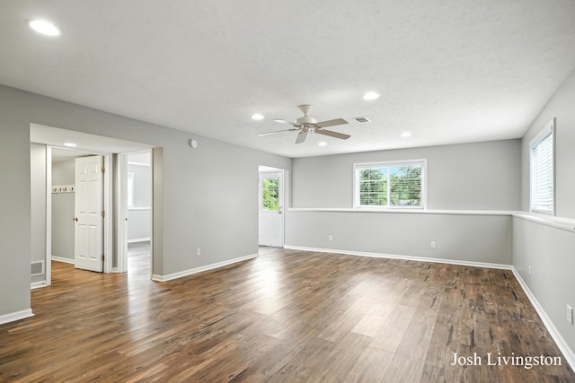 9337 Andrew Farms Dr, Alto, MI 49302 - spare room featuring plenty of natural light, recessed lighting, ceiling fan, and wood finished floors
