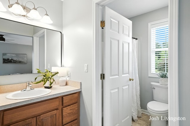 9337 Andrew Farms Dr, Alto, MI 49302 - full bathroom with vanity, plenty of natural light, ceiling fan, and tile patterned flooring