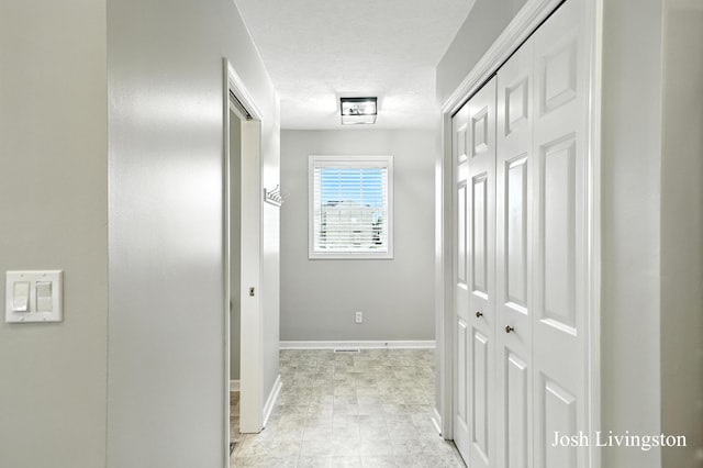9337 Andrew Farms Dr, Alto, MI 49302 - hall with baseboards and a textured ceiling