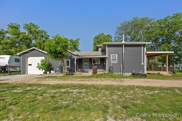 4555 Charles St, Palo, MI 48870 - back of house featuring driveway, a lawn, and covered porch