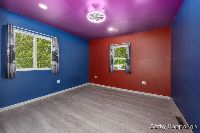 4555 Charles St, Palo, MI 48870 - spare room featuring wood finished floors and recessed lighting