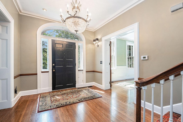 60 Lafayette Ave NE, Grand Rapids, MI 49503 - entryway with wood finished floors, a chandelier, and crown molding