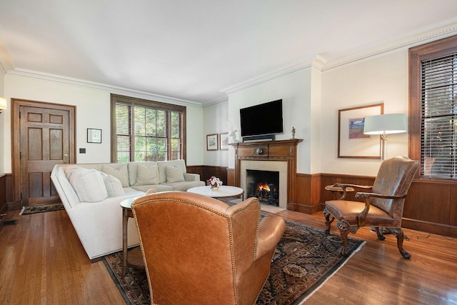 60 Lafayette Ave NE, Grand Rapids, MI 49503 - living room featuring wood finished floors, a fireplace with flush hearth, crown molding, wainscoting, and wooden walls