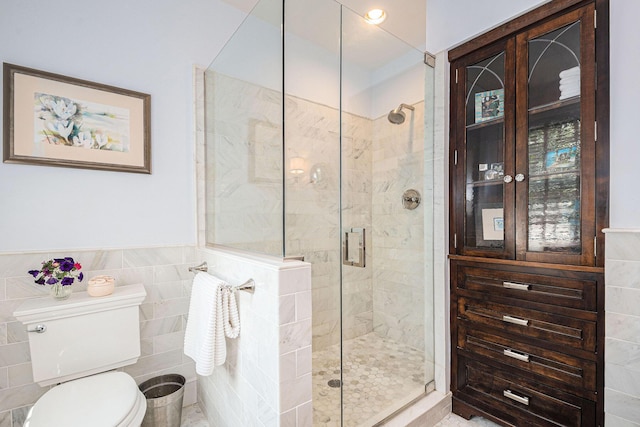 60 Lafayette Ave NE, Grand Rapids, MI 49503 - full bathroom featuring tile walls, a stall shower, and wainscoting