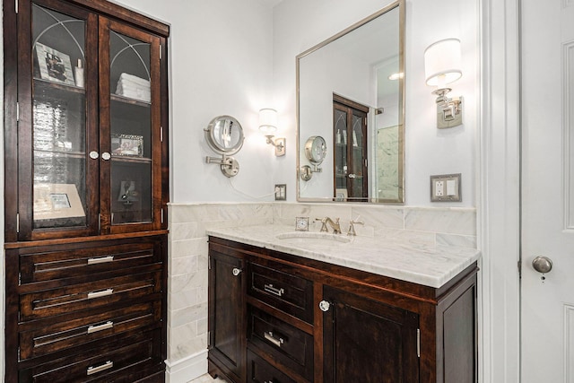 60 Lafayette Ave NE, Grand Rapids, MI 49503 - bathroom featuring vanity, tile walls, and a wainscoted wall