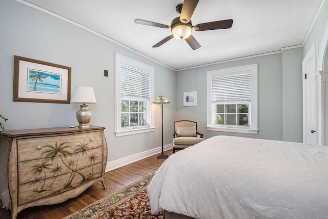 60 Lafayette Ave NE, Grand Rapids, MI 49503 - bedroom with wood finished floors, crown molding, and a ceiling fan