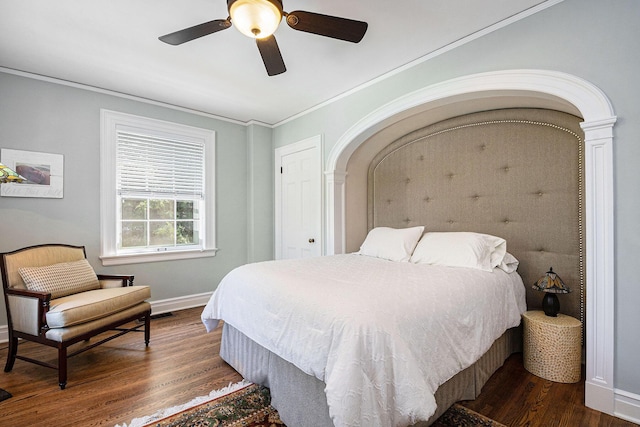 60 Lafayette Ave NE, Grand Rapids, MI 49503 - bedroom with dark wood-type flooring, arched walkways, crown molding, and ceiling fan