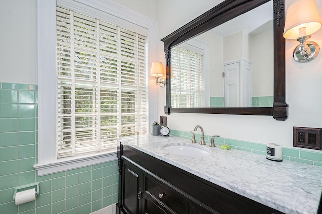 60 Lafayette Ave NE, Grand Rapids, MI 49503 - bathroom featuring plenty of natural light, vanity, and tile walls