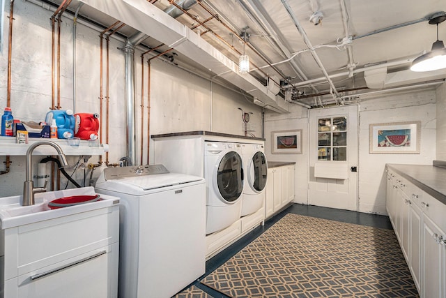 60 Lafayette Ave NE, Grand Rapids, MI 49503 - laundry room with cabinet space and washing machine and dryer