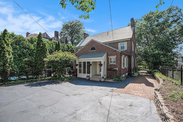 60 Lafayette Ave NE, Grand Rapids, MI 49503 - view of front of home featuring brick siding and a chimney