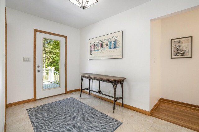 6368 E Lake Ln, Sawyer, MI 49125 - entrance foyer featuring light tile patterned floors and baseboards