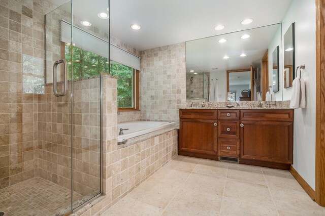 6368 E Lake Ln, Sawyer, MI 49125 - bathroom featuring a stall shower, a bath, double vanity, recessed lighting, and tile patterned floors