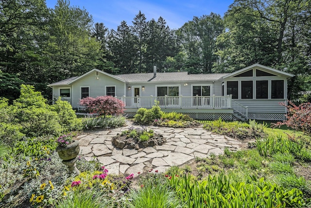 6368 E Lake Ln, Sawyer, MI 49125 - rear view of house featuring a sunroom, a patio, and a wooden deck