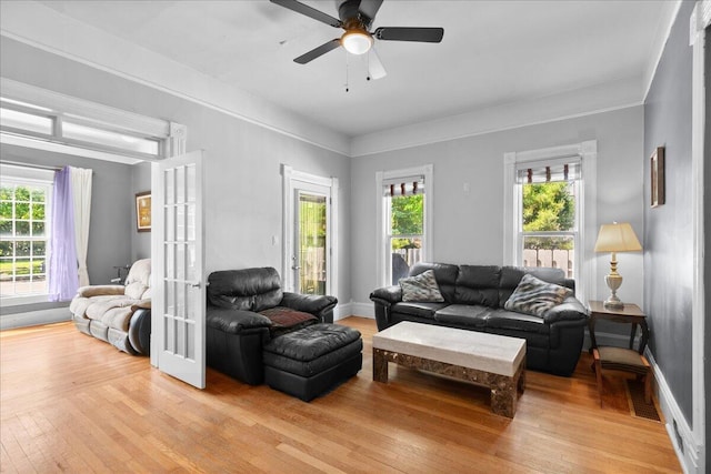 905 Harrison Ave, Saint Joseph, MI 49085 - living area featuring light wood finished floors, french doors, healthy amount of natural light, and ceiling fan
