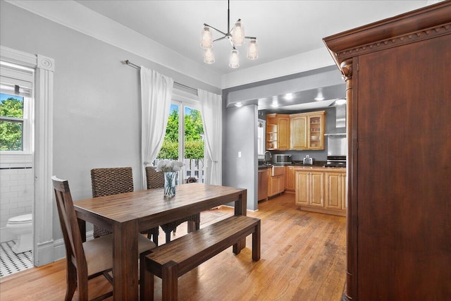 905 Harrison Ave, Saint Joseph, MI 49085 - dining area with light wood-style flooring and a chandelier