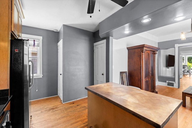 905 Harrison Ave, Saint Joseph, MI 49085 - kitchen with freestanding refrigerator, ceiling fan, light wood finished floors, and wood counters