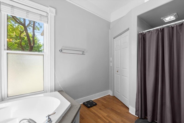 905 Harrison Ave, Saint Joseph, MI 49085 - bathroom with a bath, wood finished floors, and curtained shower
