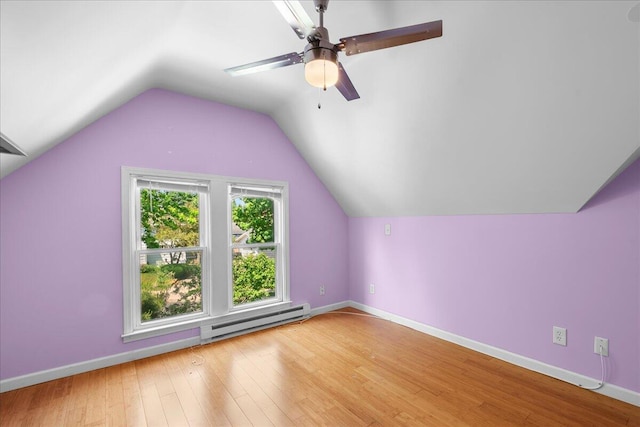905 Harrison Ave, Saint Joseph, MI 49085 - additional living space featuring a baseboard heating unit, ceiling fan, wood finished floors, and lofted ceiling