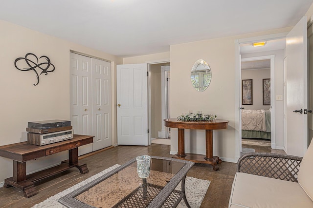209 Maple St, Three Oaks, MI 49128 - living area featuring dark wood-style flooring and baseboards