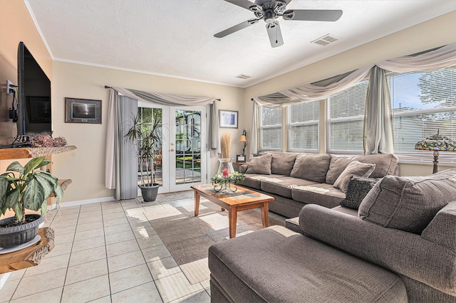 209 Maple St, Three Oaks, MI 49128 - living area featuring light tile patterned floors, ceiling fan, ornamental molding, and french doors
