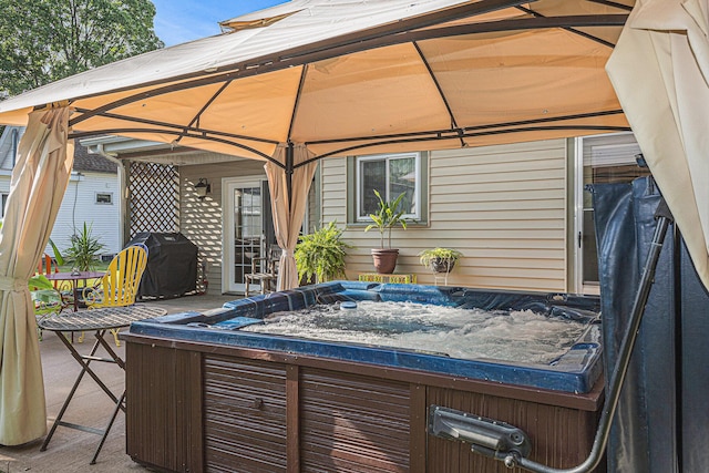 209 Maple St, Three Oaks, MI 49128 - view of patio with a hot tub, a gazebo, and area for grilling