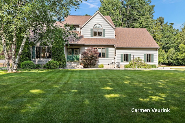 1723 S Sullivan Rd, Ravenna, MI 49451 - view of front facade with a front yard, roof with shingles, and entry steps