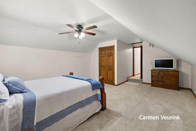 1723 S Sullivan Rd, Ravenna, MI 49451 - bedroom featuring vaulted ceiling, carpet, and ceiling fan