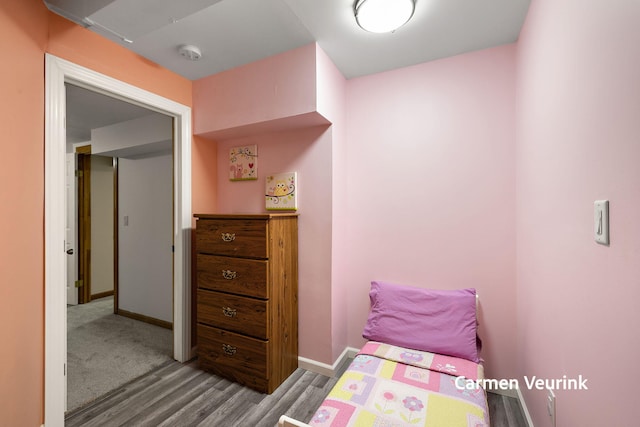 1723 S Sullivan Rd, Ravenna, MI 49451 - bedroom with wood finished floors and baseboards