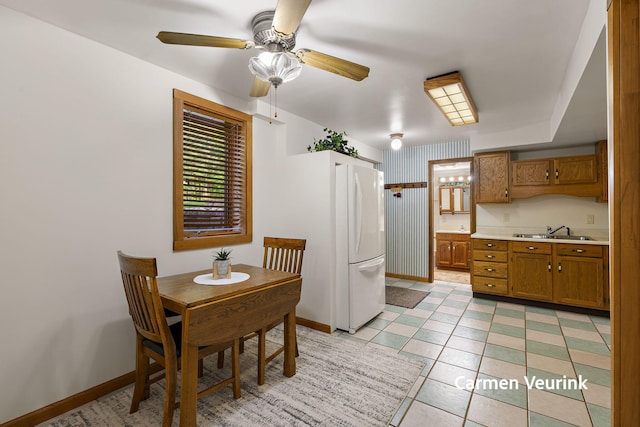 1723 S Sullivan Rd, Ravenna, MI 49451 - dining area featuring ceiling fan and light tile patterned flooring