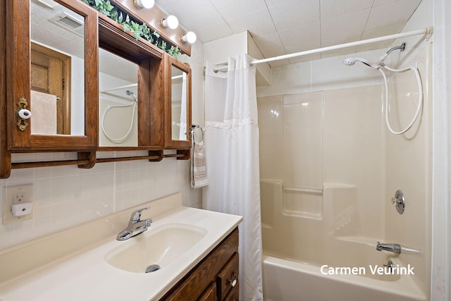 1723 S Sullivan Rd, Ravenna, MI 49451 - bathroom featuring shower / tub combo with curtain, vanity, and backsplash