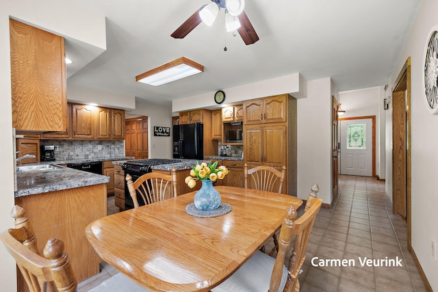 1723 S Sullivan Rd, Ravenna, MI 49451 - dining area with ceiling fan and light tile patterned floors