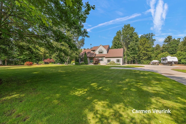1723 S Sullivan Rd, Ravenna, MI 49451 - view of front of house with a front lawn