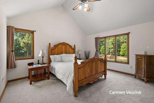 1723 S Sullivan Rd, Ravenna, MI 49451 - bedroom featuring multiple windows, light carpet, a ceiling fan, and high vaulted ceiling