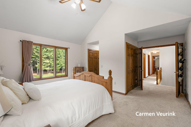 1723 S Sullivan Rd, Ravenna, MI 49451 - bedroom with light colored carpet, high vaulted ceiling, and ceiling fan