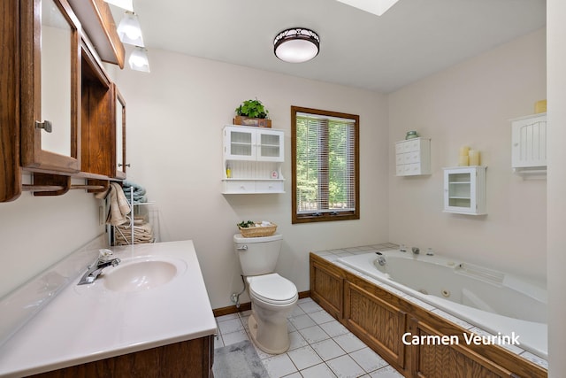 1723 S Sullivan Rd, Ravenna, MI 49451 - bathroom with a whirlpool tub, vanity, and tile patterned flooring