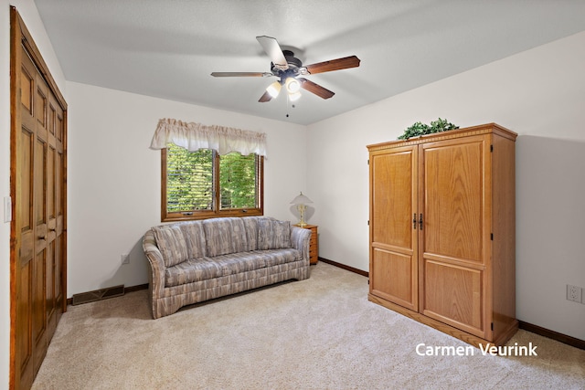 1723 S Sullivan Rd, Ravenna, MI 49451 - living room featuring light carpet and ceiling fan