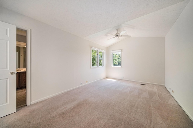 3350 Breckland Ct, Ann Arbor, MI 48108 - unfurnished bedroom with light colored carpet, a ceiling fan, and vaulted ceiling
