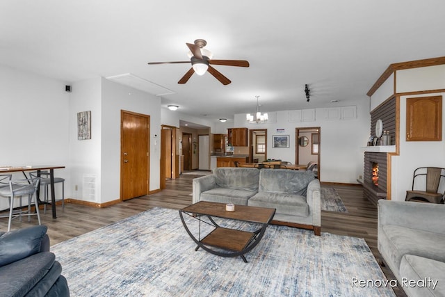 4278 W Joy Rd, Shelbyville, MI 49344 - living room featuring ceiling fan, attic access, wood finished floors, and a brick fireplace