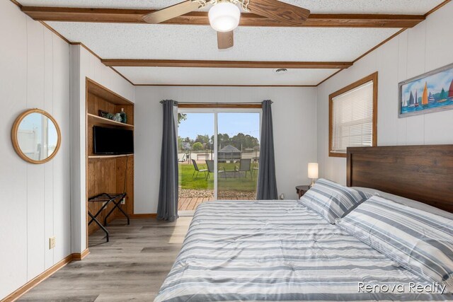 4278 W Joy Rd, Shelbyville, MI 49344 - bedroom with beam ceiling, access to outside, light wood-style flooring, a textured ceiling, and wood walls