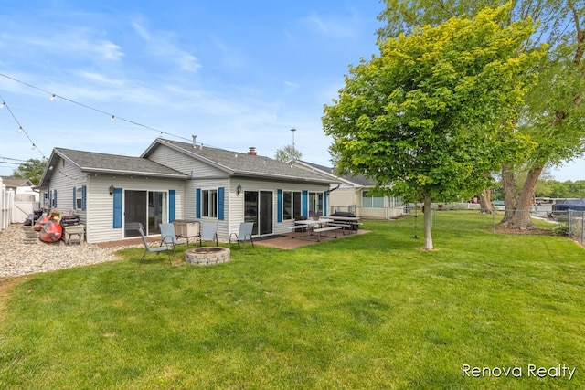 4278 W Joy Rd, Shelbyville, MI 49344 - rear view of property with a fire pit, a patio area, a fenced backyard, and roof with shingles