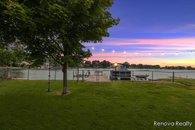 4278 W Joy Rd, Shelbyville, MI 49344 - yard at dusk with a water view