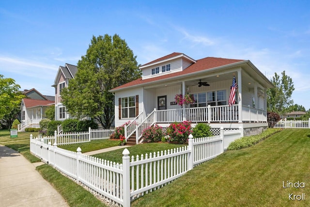 195 Liberty St NW, Sparta, MI 49345 - bungalow-style home featuring covered porch, a ceiling fan, and a fenced front yard