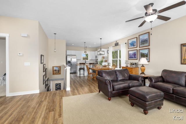 195 Liberty St NW, Sparta, MI 49345 - living room featuring wood finished floors and a ceiling fan