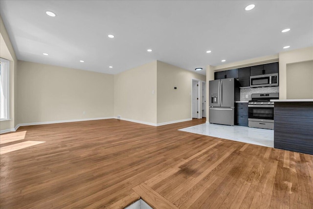 20232 Braile St, Detroit, MI 48219 - unfurnished living room featuring light wood-style flooring and recessed lighting