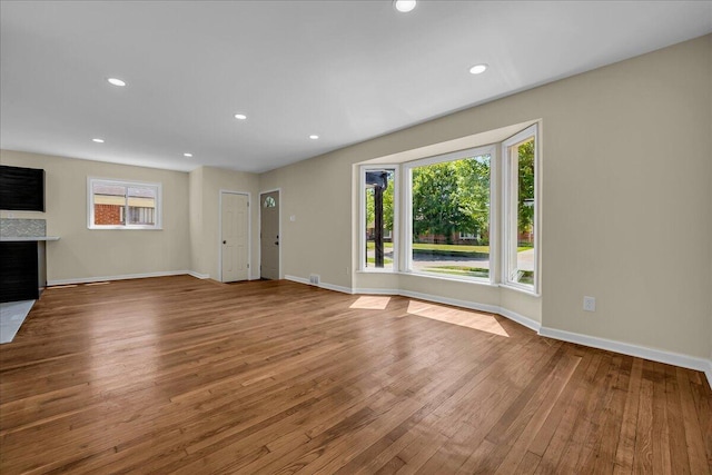 20232 Braile St, Detroit, MI 48219 - unfurnished living room featuring hardwood / wood-style flooring, a fireplace, and recessed lighting