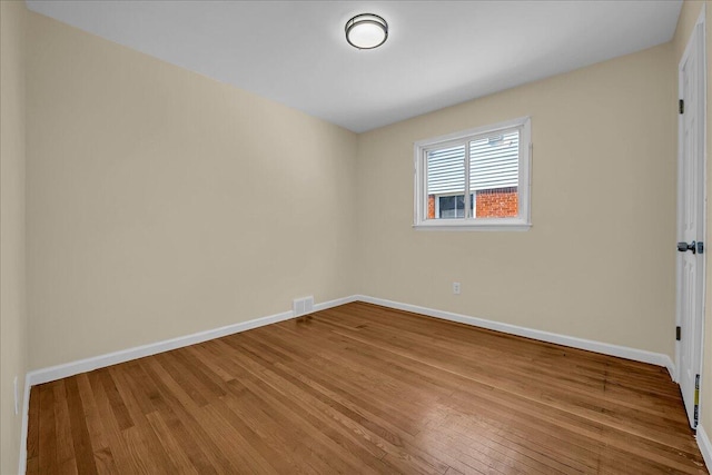 20232 Braile St, Detroit, MI 48219 - unfurnished room with baseboards and wood finished floors