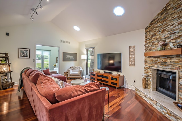 3185 Shadberry Ct, Saline, MI 48176 - living room with wood finished floors, high vaulted ceiling, and a fireplace