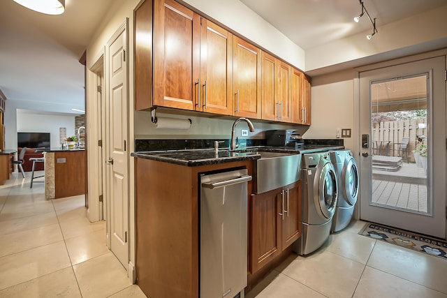 3185 Shadberry Ct, Saline, MI 48176 - laundry room featuring separate washer and dryer, light tile patterned flooring, rail lighting, and cabinet space