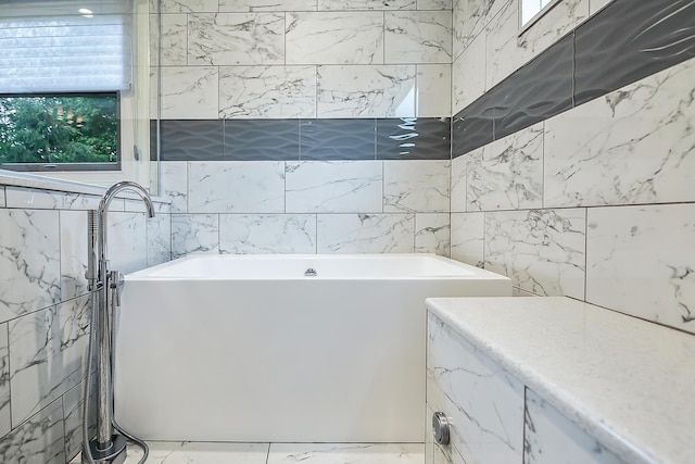 3185 Shadberry Ct, Saline, MI 48176 - full bath featuring tile walls, healthy amount of natural light, and a soaking tub