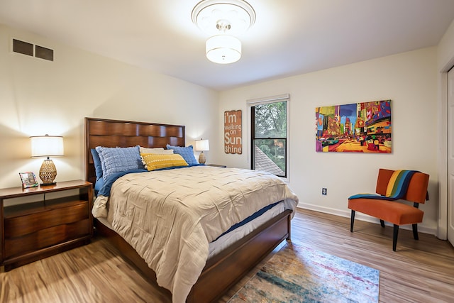 3185 Shadberry Ct, Saline, MI 48176 - bedroom featuring wood finished floors and baseboards